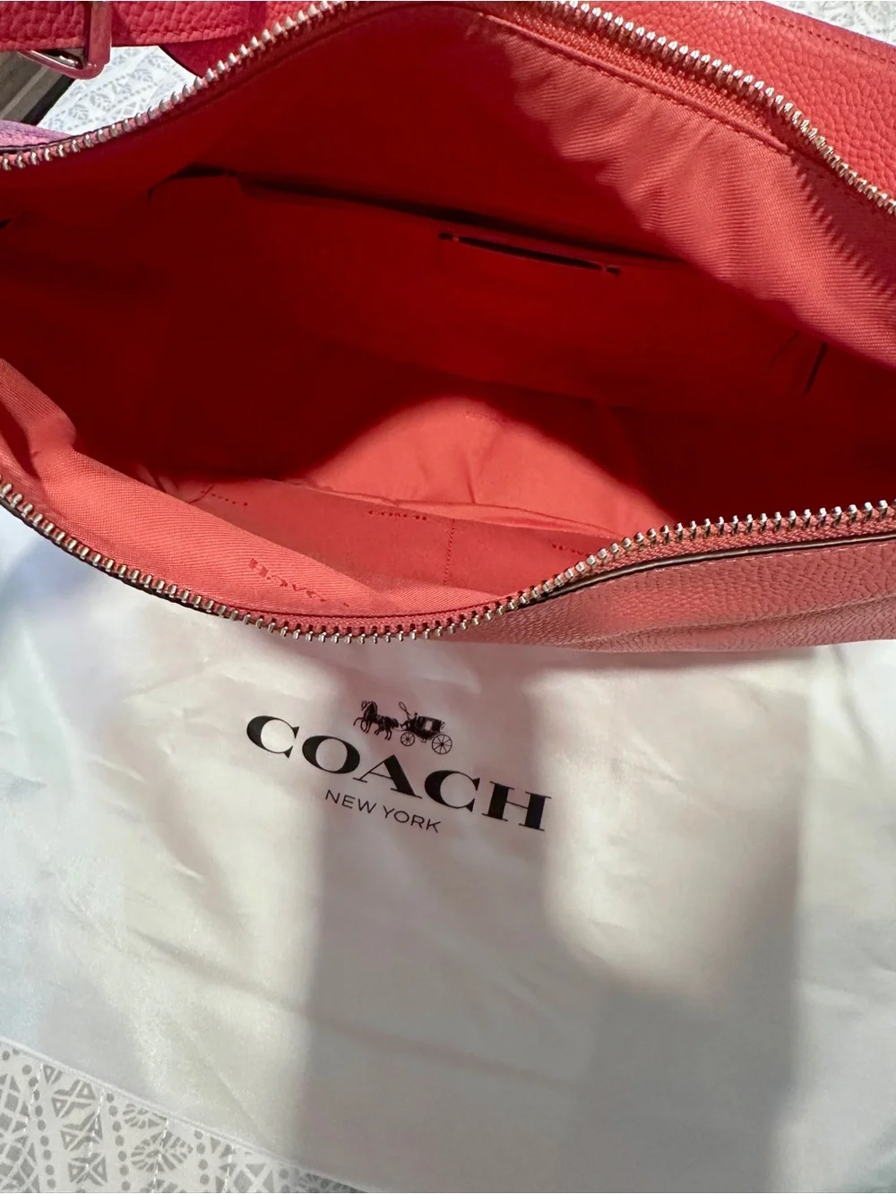 Coach Pebbled Leather Hobo Bag in Coral